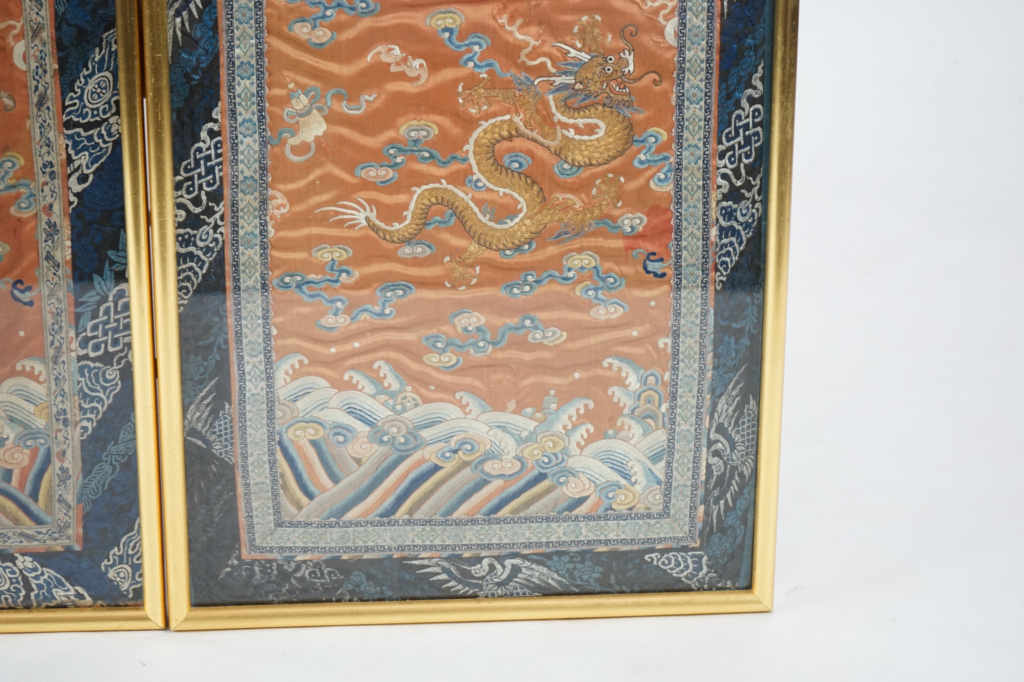 A pair of Chinese coral silk ‘dragon’ panels, 19th century